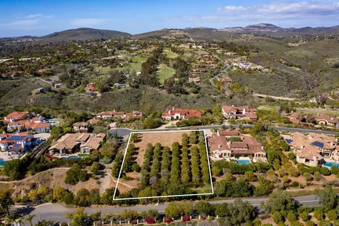 an aerial view of residential houses and outdoor space