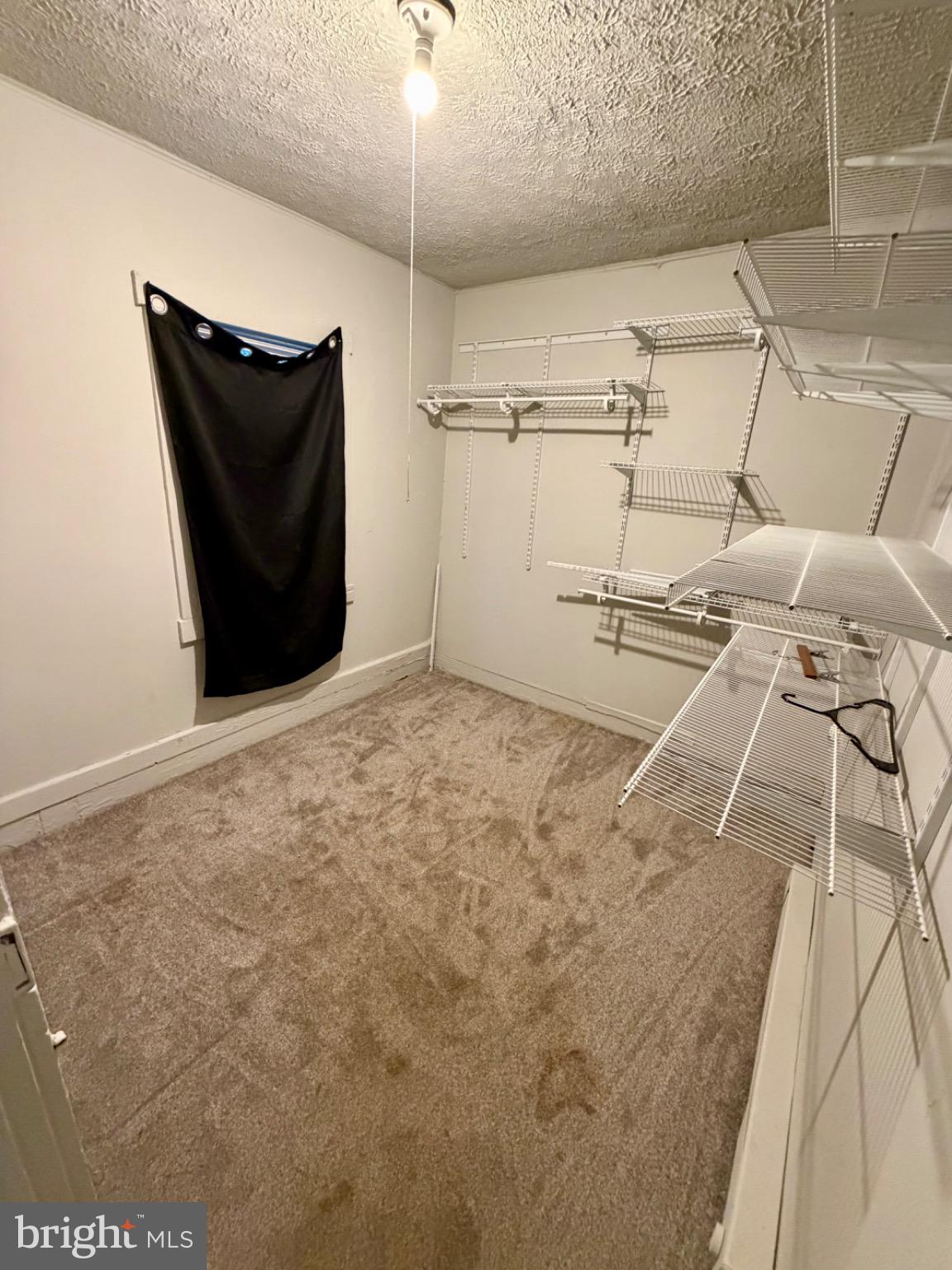 528 Fremont Street Winchester, VA 22601 - Photo 14 of 16 a view of a room with racks on the wall