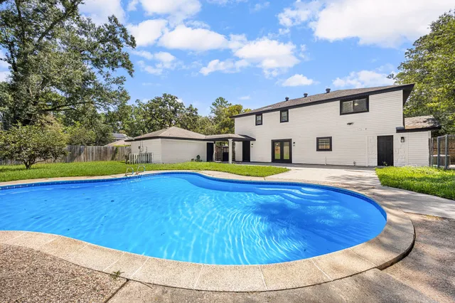 a view of a house with swimming pool