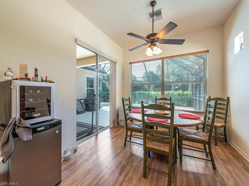 7896 Founders Circle Naples, FL 34104 - Photo 4 of 12 a outdoor space with furniture and wooden floor