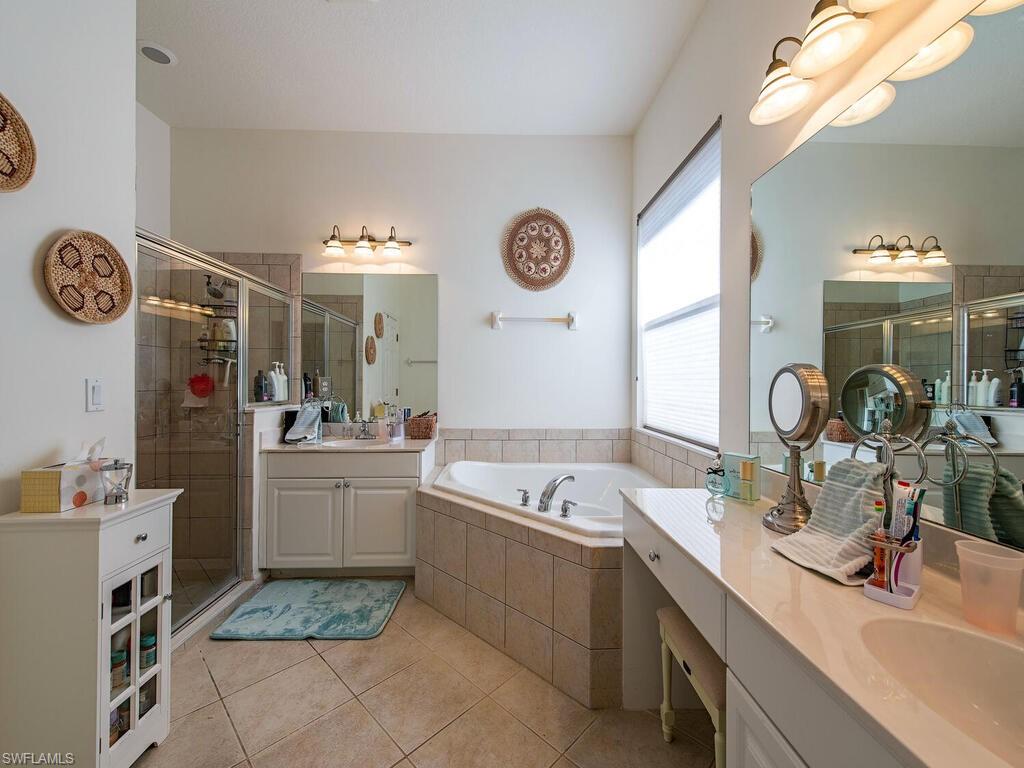 7896 Founders Circle Naples, FL 34104 - Photo 7 of 12 a very nice looking rest room with a large window