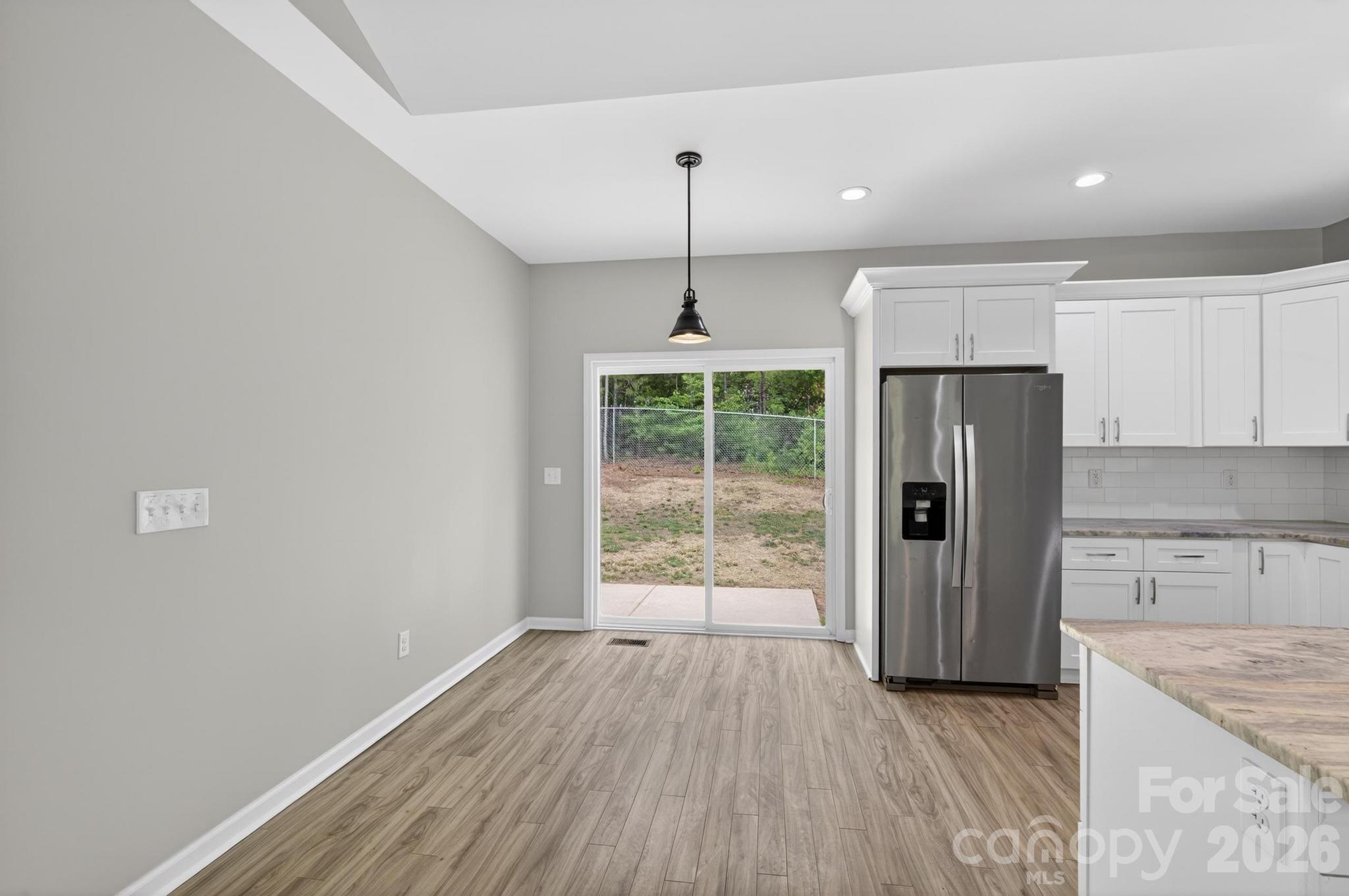 2119 South Road Morganton, NC 28655 - Photo 15 of 47 a kitchen with stainless steel appliances a refrigerator and wooden floor