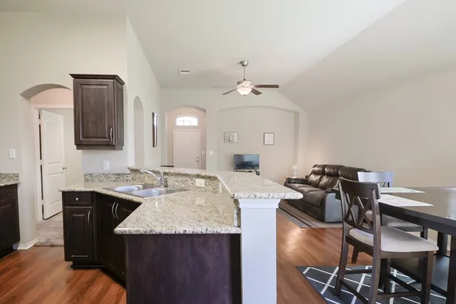 a view of a kitchen area kitchen island furniture and wooden floor