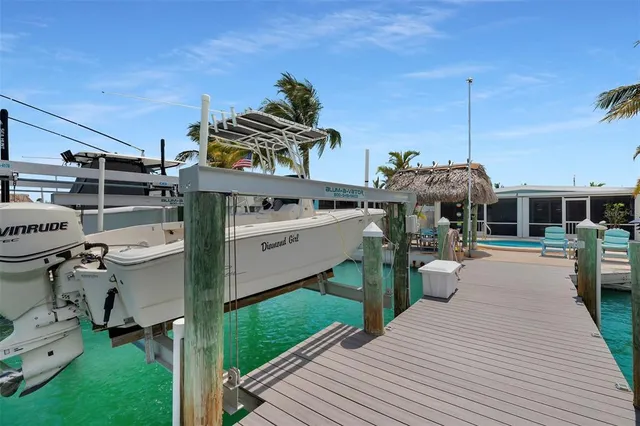a swimming pool with outdoor seating and yard