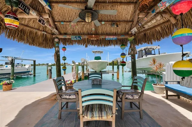 a view of a chairs and table on the patio