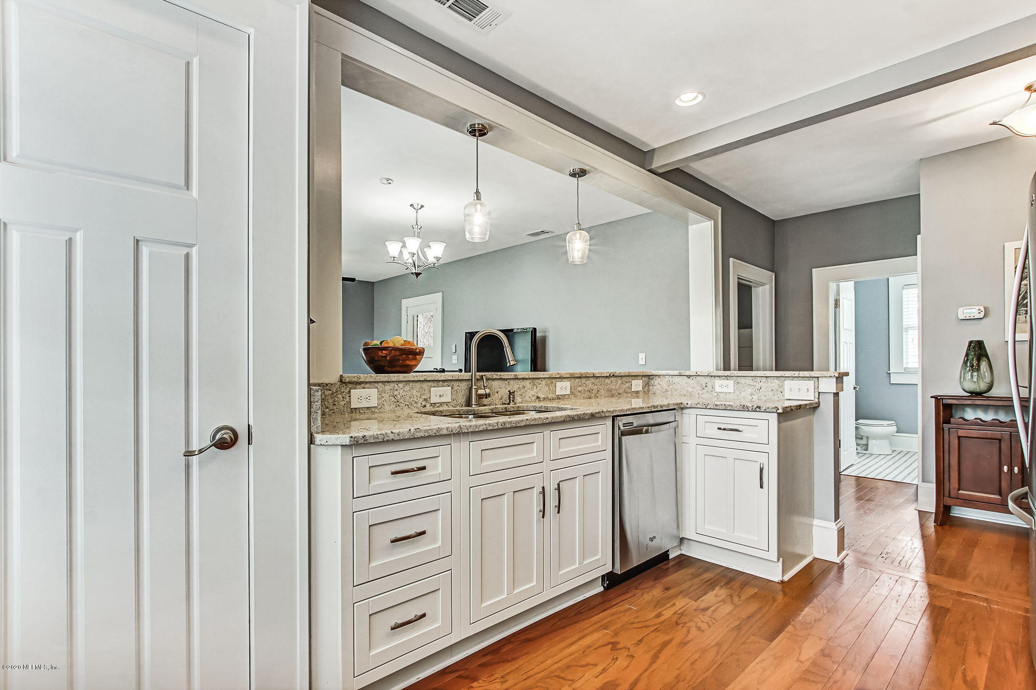 1292 Wolfe Street Jacksonville, FL 32205 - Photo 20 of 38 a spacious bathroom with a granite countertop sink a mirror and a shower