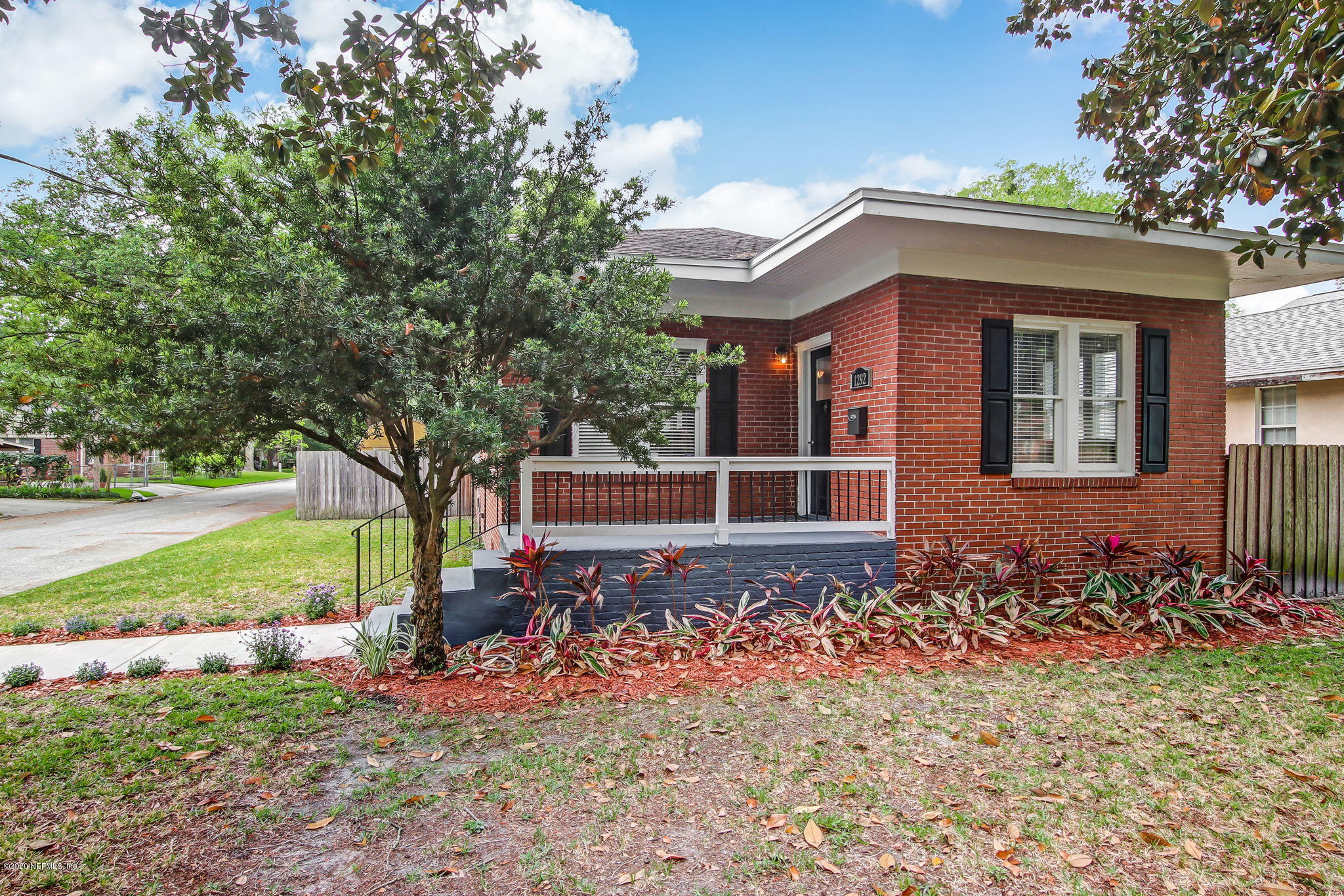 1292 Wolfe Street Jacksonville, FL 32205 - Photo 2 of 38 front view of a house with a big yard