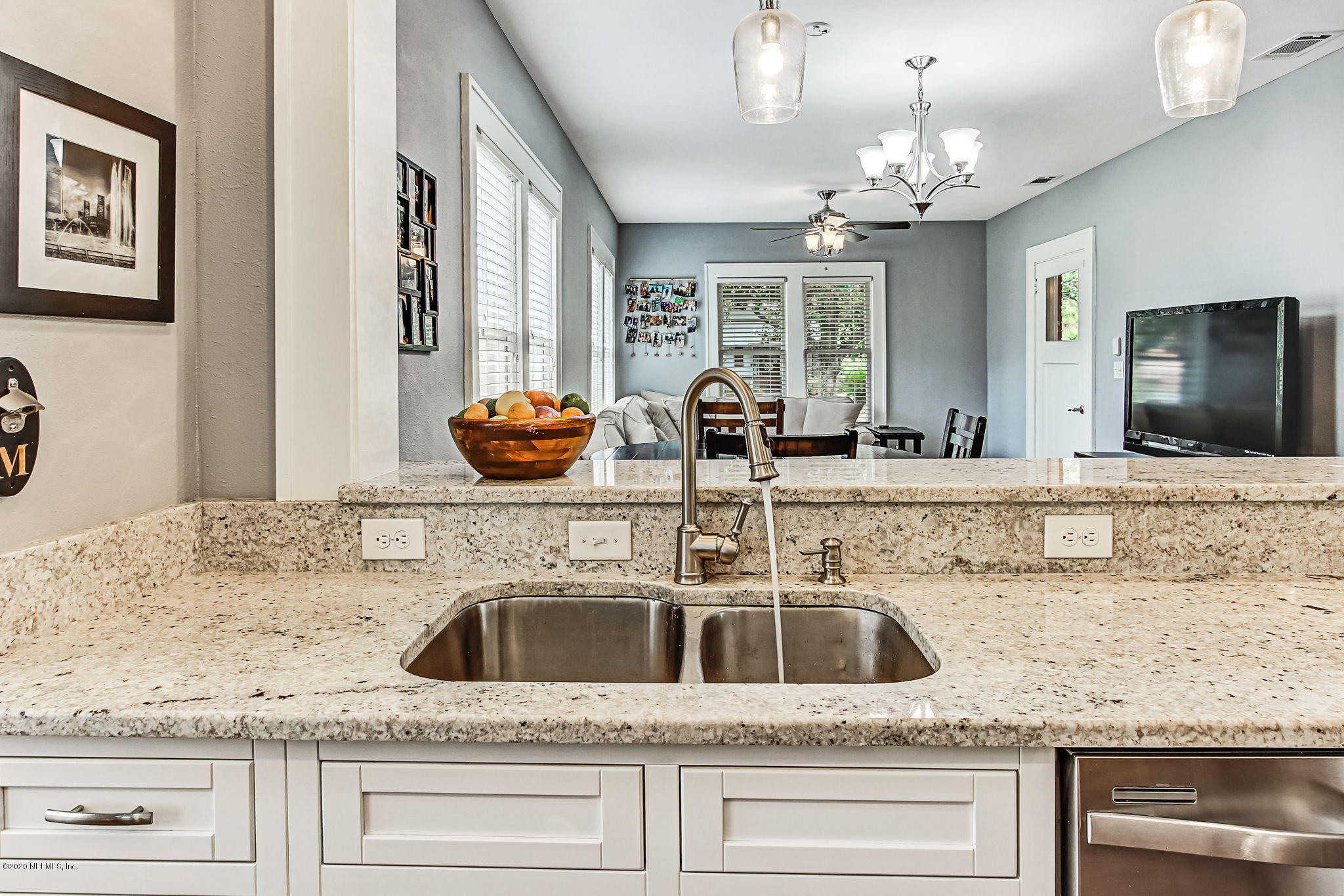 1292 Wolfe Street Jacksonville, FL 32205 - Photo 22 of 38 a bathroom with granite countertop a sink and a mirror