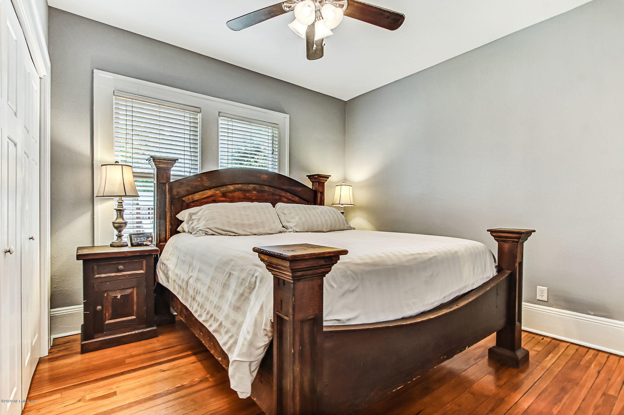 1292 Wolfe Street Jacksonville, FL 32205 - Photo 23 of 38 a bedroom with a bed and a chandelier
