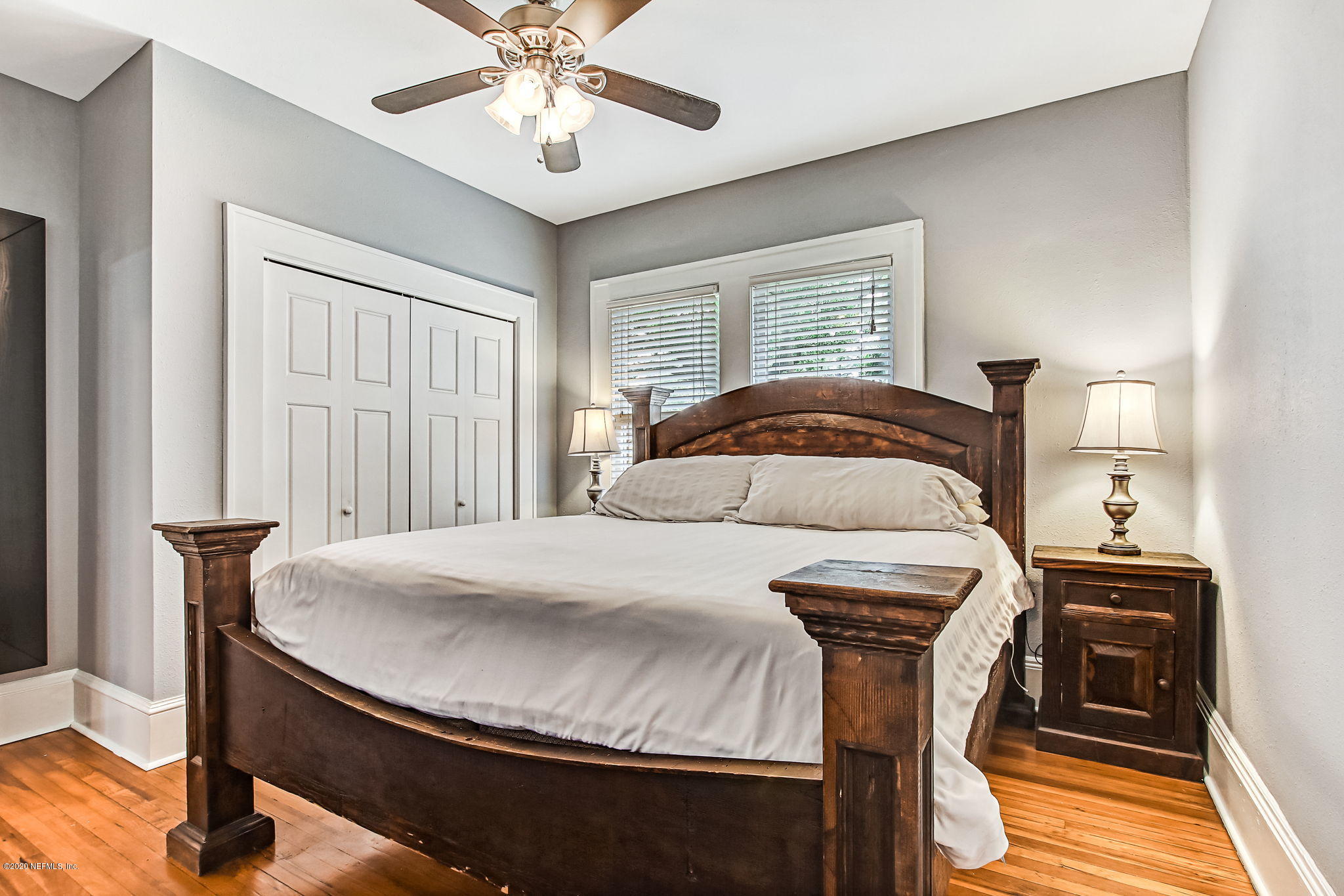 1292 Wolfe Street Jacksonville, FL 32205 - Photo 24 of 38 a bedroom with a bed and a chandelier
