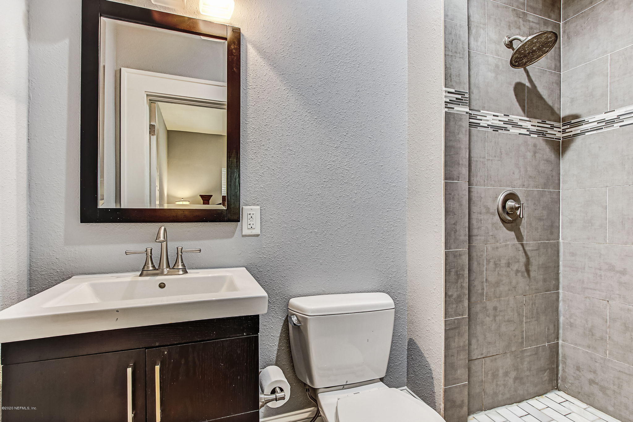 1292 Wolfe Street Jacksonville, FL 32205 - Photo 25 of 38 a bathroom with a toilet sink shower and mirror