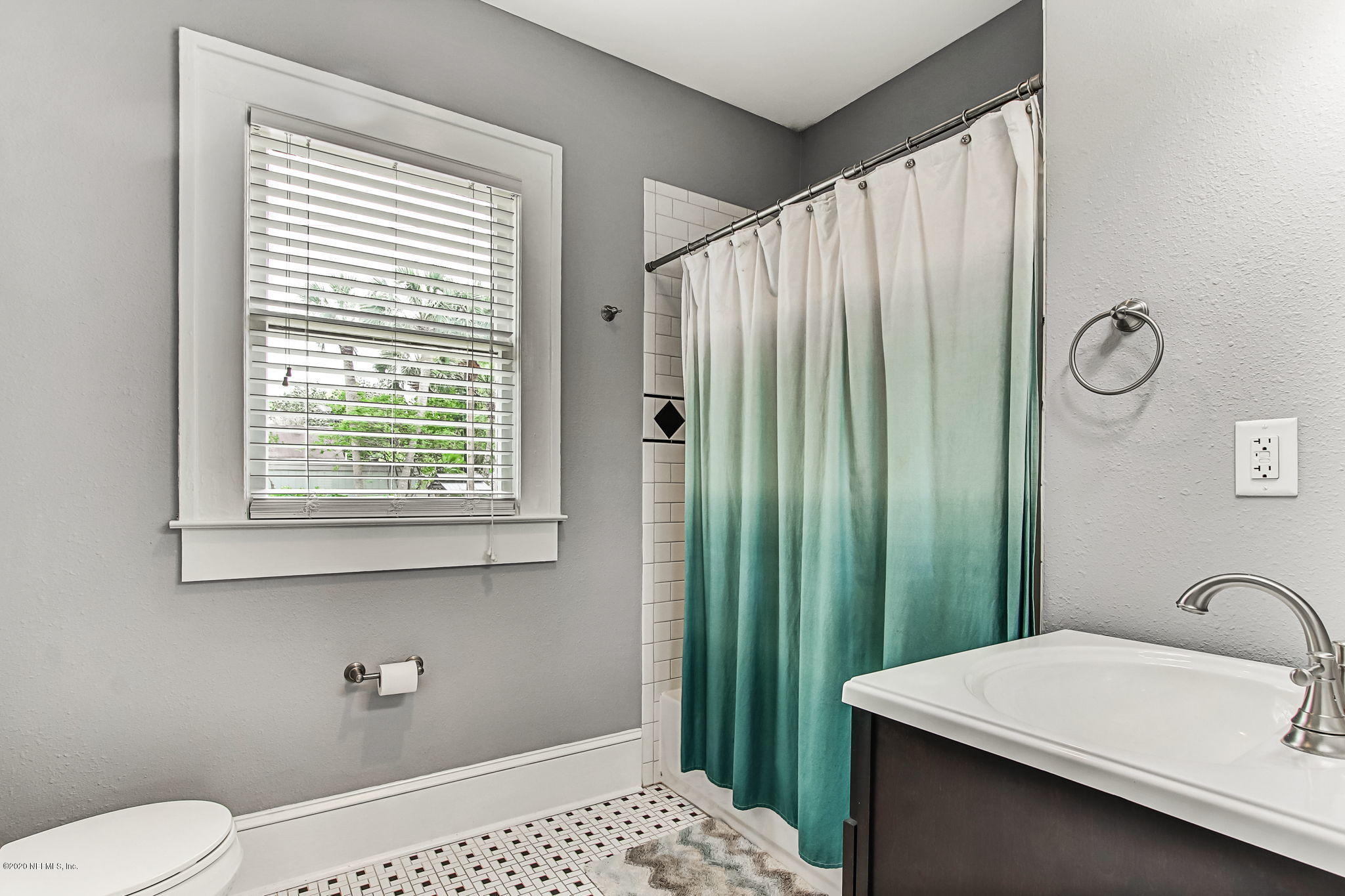 1292 Wolfe Street Jacksonville, FL 32205 - Photo 28 of 38 a bathroom with a sink a toilet and shower