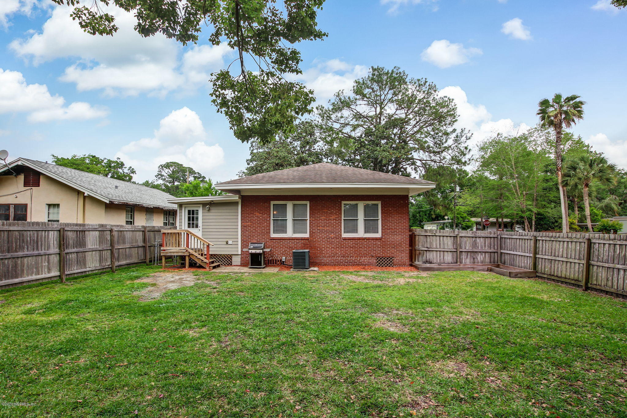 1292 Wolfe Street Jacksonville, FL 32205 - Photo 34 of 38 a front view of a house with a yard and trees