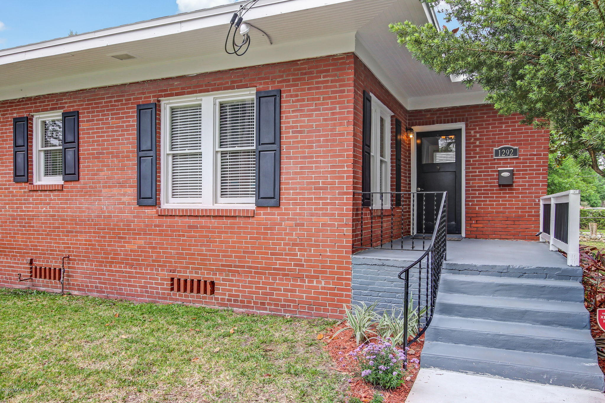 1292 Wolfe Street Jacksonville, FL 32205 - Photo 6 of 38 a front view of a house with a porch