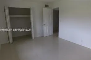 an empty room with cabinet