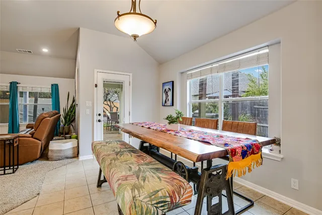 a kitchen with stainless steel appliances a stove a sink island and a refrigerator