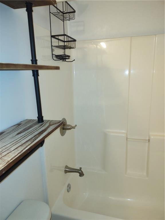 7675 Campground Road, Unit A Cumming, GA 30040 - Photo 13 of 13 a bathroom with a shower