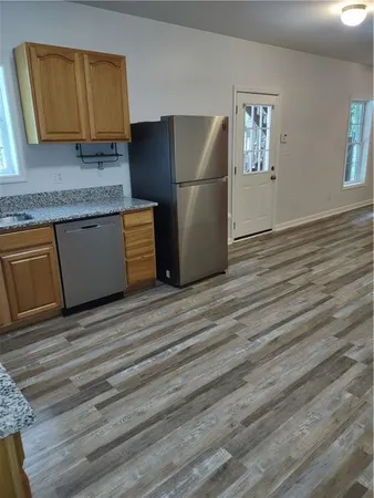 a view of a livingroom with furniture and wooden floor