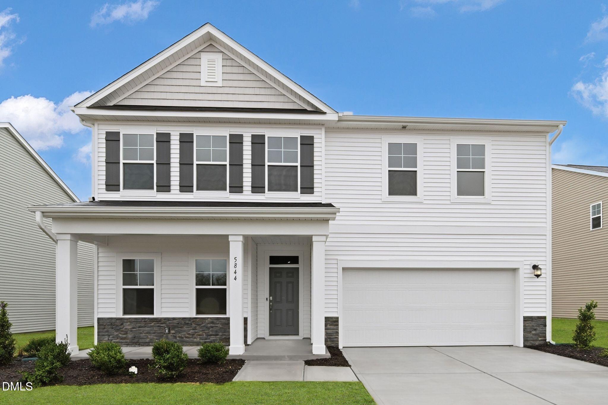 front view of a house and a yard