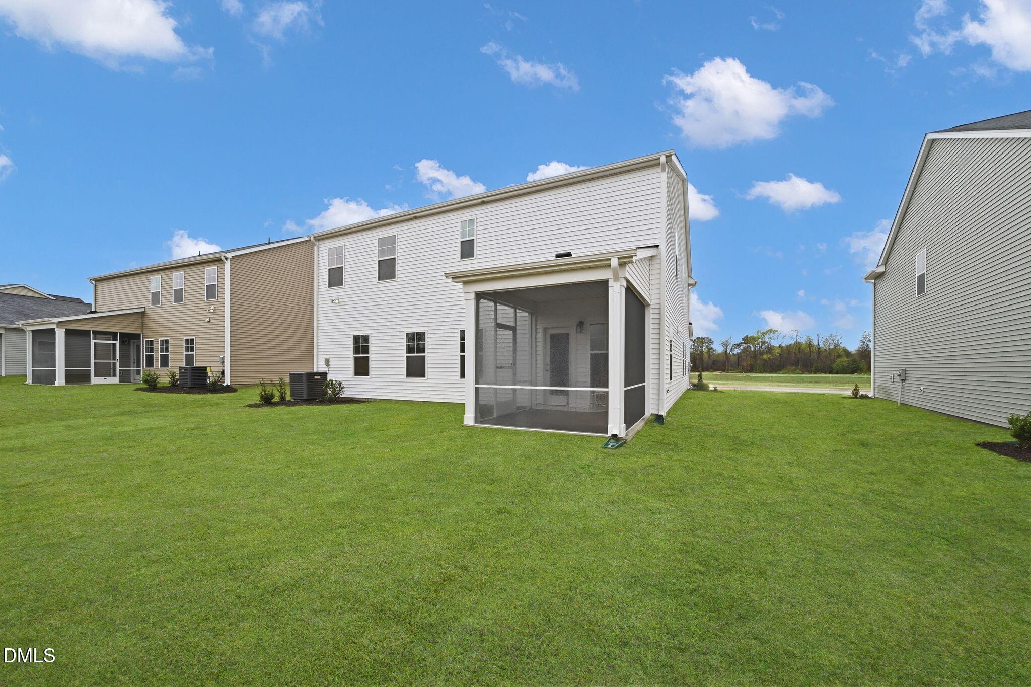 5844 Millstone Way Sims, NC 27880 - Photo 28 of 34 a view of a white house with backyard