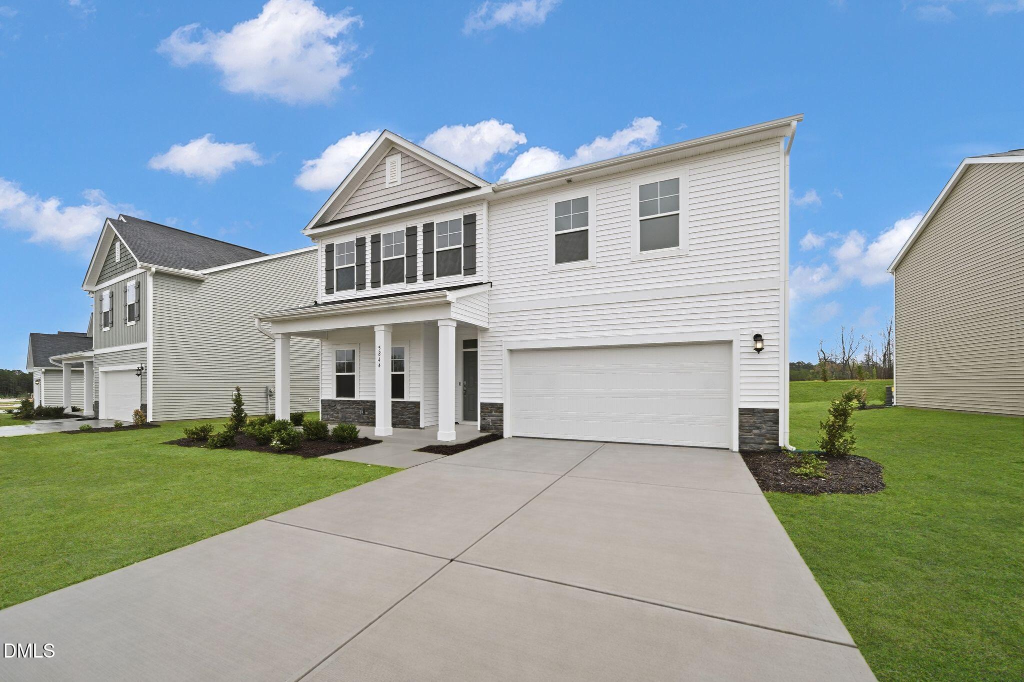 5844 Millstone Way Sims, NC 27880 - Photo 4 of 34 a front view of a house with a yard