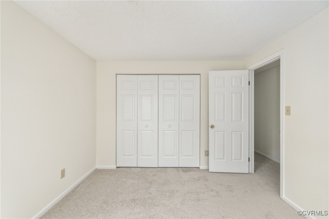 9645 Benbow Road North Chesterfield, VA 23235 - Photo 28 of 44 Bedrooms three and four, both with carpet, offer s