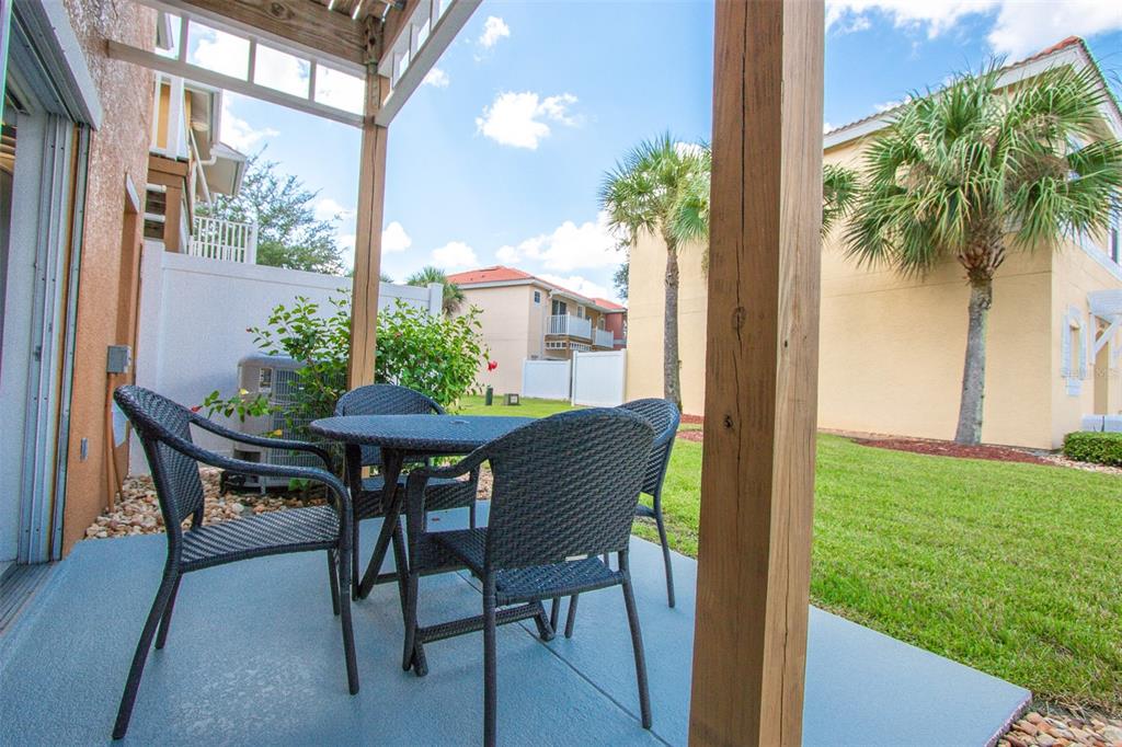 1103 Park Ridge Circle Kissimmee, FL 34746 - Photo 24 of 72 a view of a dining room with a table and chairs