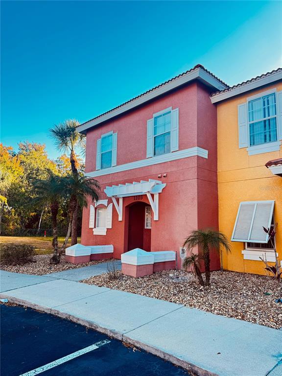1103 Park Ridge Circle Kissimmee, FL 34746 - Photo 4 of 72 a front view of a house with garden