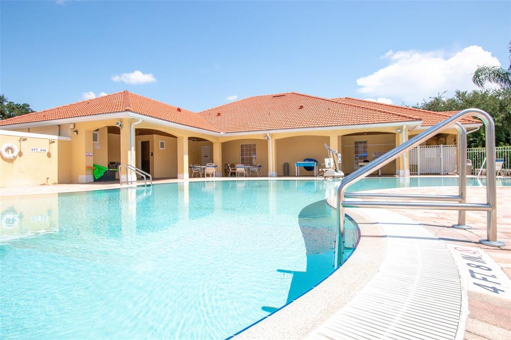 1103 Park Ridge Circle Kissimmee, FL 34746 - Photo 54 of 72 a view of a white house with a yard