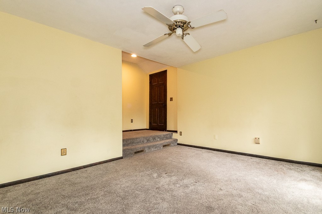 11601 Bass Lake Road Chardon, OH 44024 - Photo 24 of 50 Carpeted spare room with ceiling fan