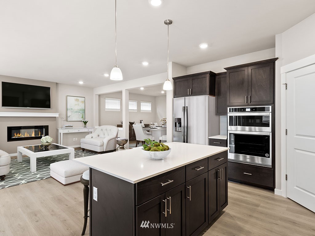 2 181st Street Southeast, Unit 12 Bothell, WA 98012 - Photo 4 of 23 a kitchen with a sink refrigerator and cabinets