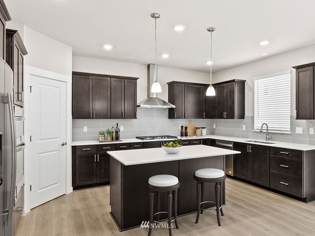 2 181st Street Southeast, Unit 12 Bothell, WA 98012 - Photo 5 of 23 a kitchen with lots of counter space sink and appliances