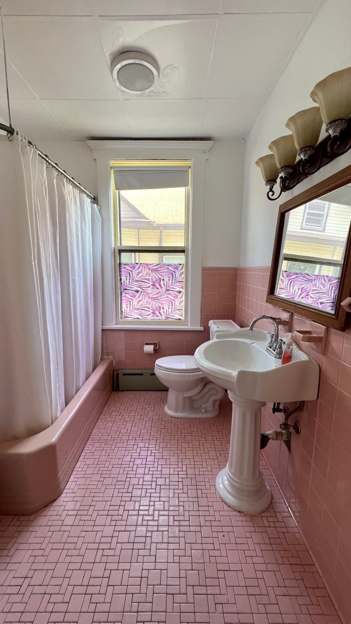 252 Murray Street, Unit 2 Elizabeth, NJ 07202 - Photo 9 of 14 a living room with a couch and a window