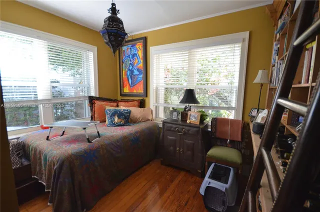 a bed room with a bed and a window