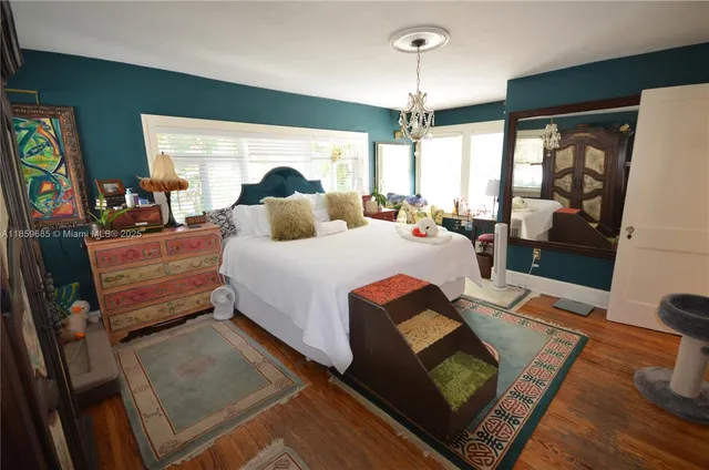 a bedroom with bed and window