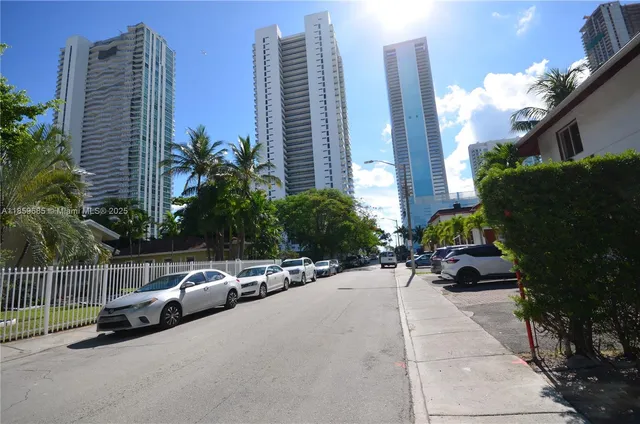 a couple of cars parked in front of buildings