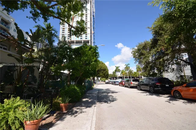 a view of street with parked cars