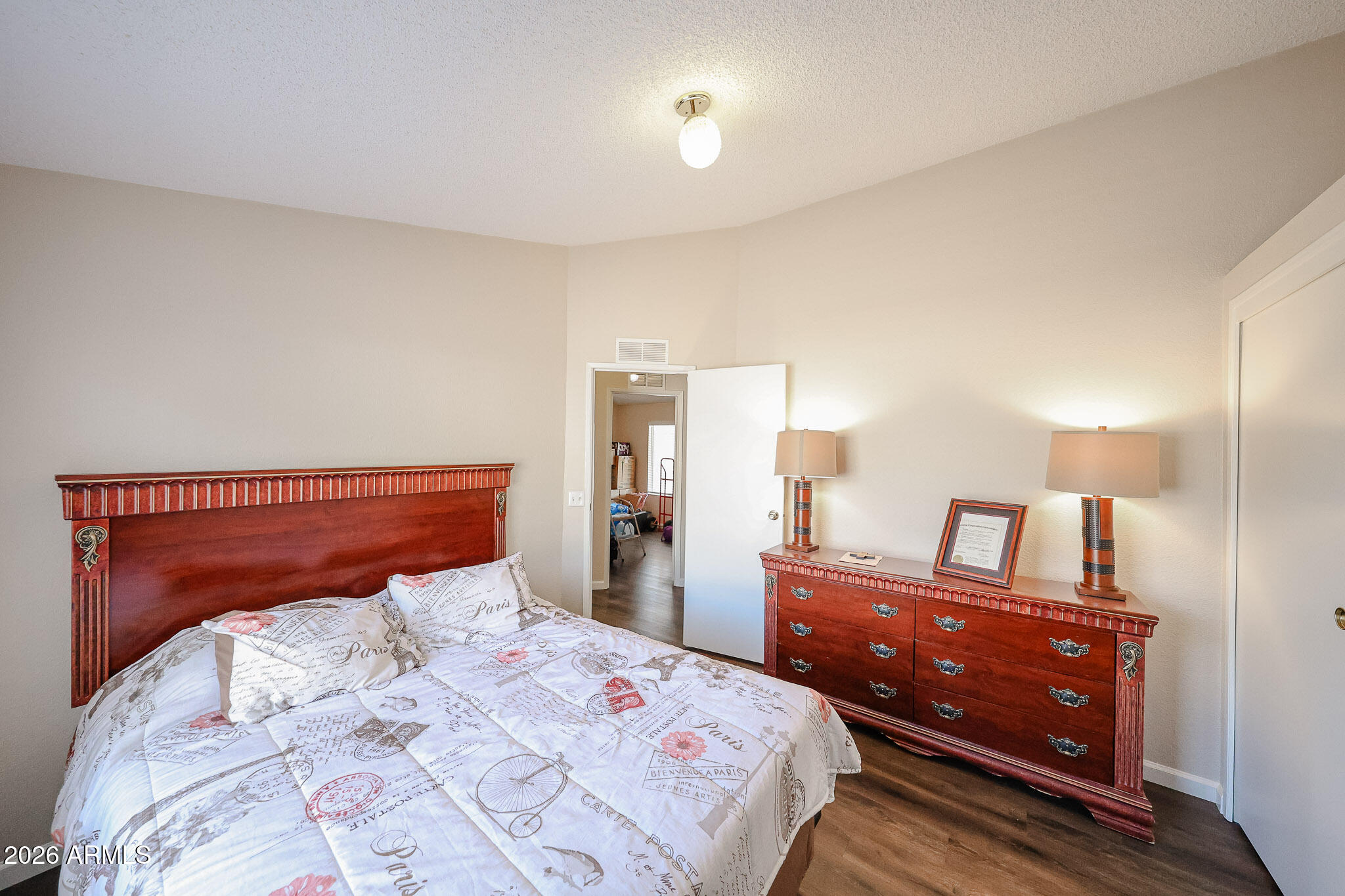 3901 East Pinnacle Peak Road, Unit 355 Phoenix, AZ 85050 - Photo 14 of 29 a bedroom with a bed and a lamp on dresser