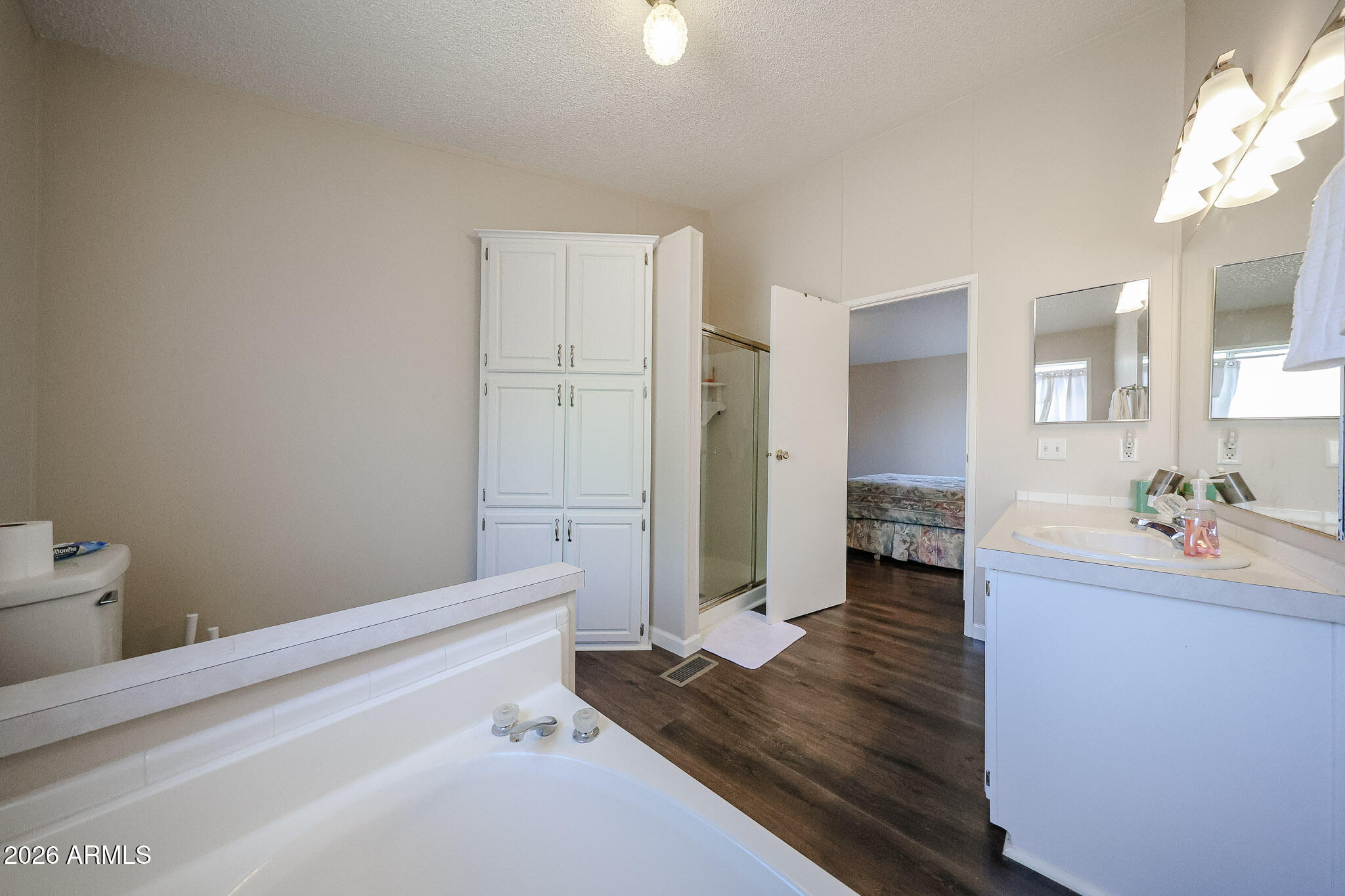 3901 East Pinnacle Peak Road, Unit 355 Phoenix, AZ 85050 - Photo 20 of 29 a bathroom with a sink and a mirror