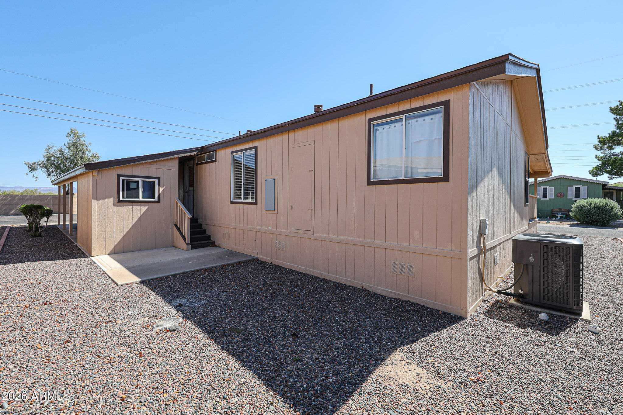 3901 East Pinnacle Peak Road, Unit 355 Phoenix, AZ 85050 - Photo 23 of 29 a front view of a house with windows