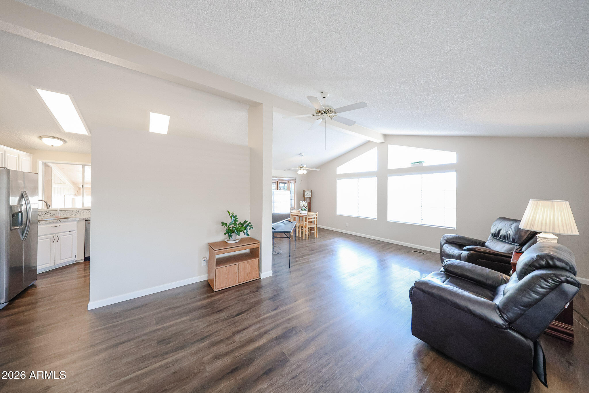 3901 East Pinnacle Peak Road, Unit 355 Phoenix, AZ 85050 - Photo 4 of 29 a living room with furniture and a wooden floor