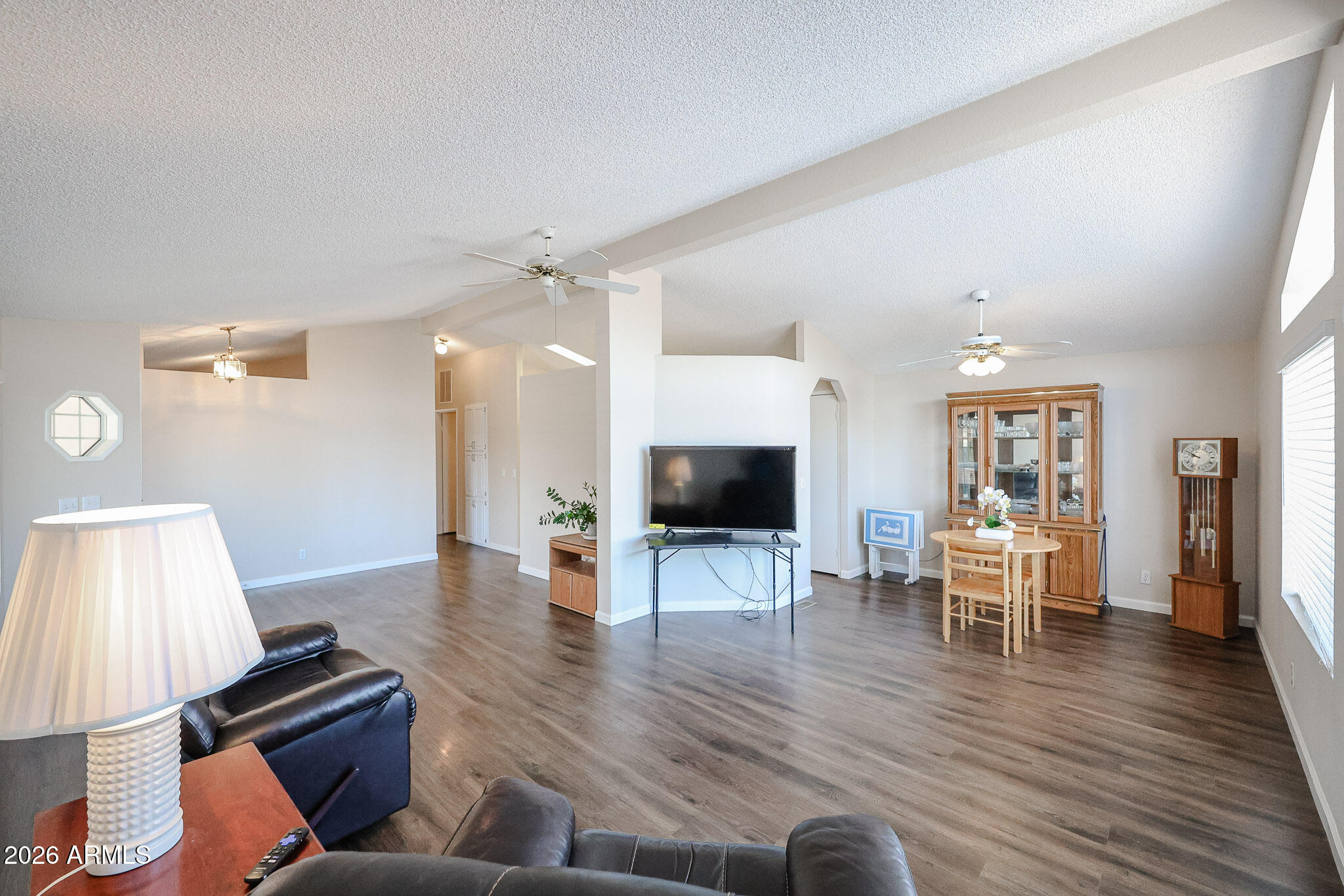 3901 East Pinnacle Peak Road, Unit 355 Phoenix, AZ 85050 - Photo 6 of 29 a living room with furniture and a wooden floor