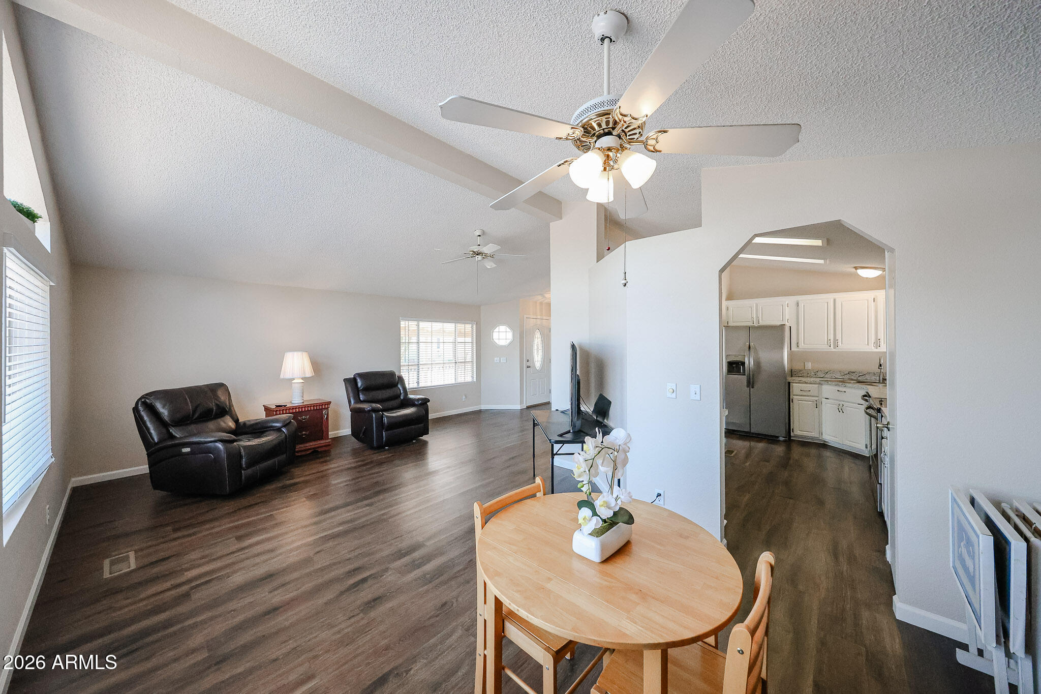 3901 East Pinnacle Peak Road, Unit 355 Phoenix, AZ 85050 - Photo 7 of 29 a living room with fireplace furniture and a chandelier