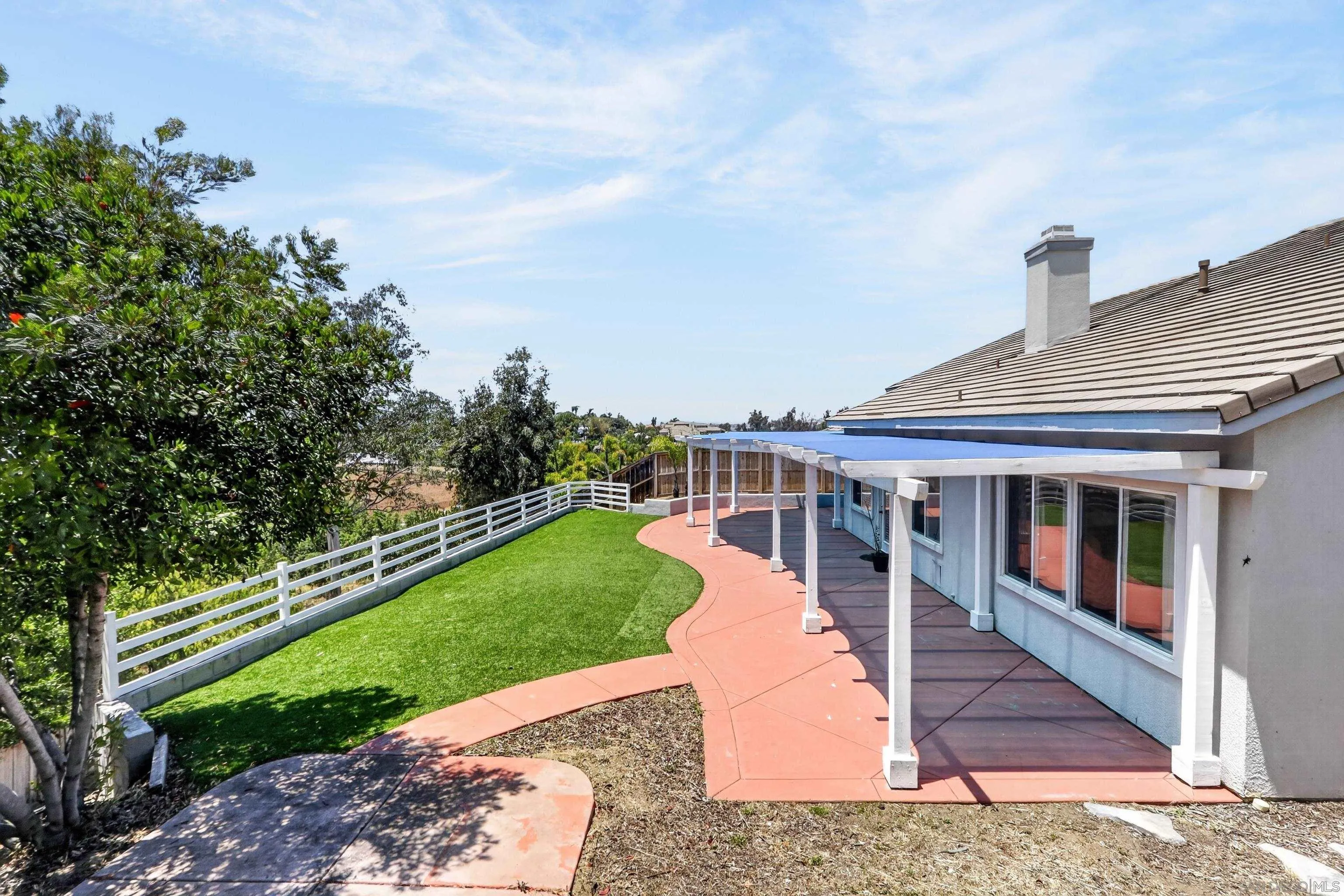 1432 Belmont Park Road Oceanside, CA 92057 - Photo 10 of 54 a view of a house with a backyard