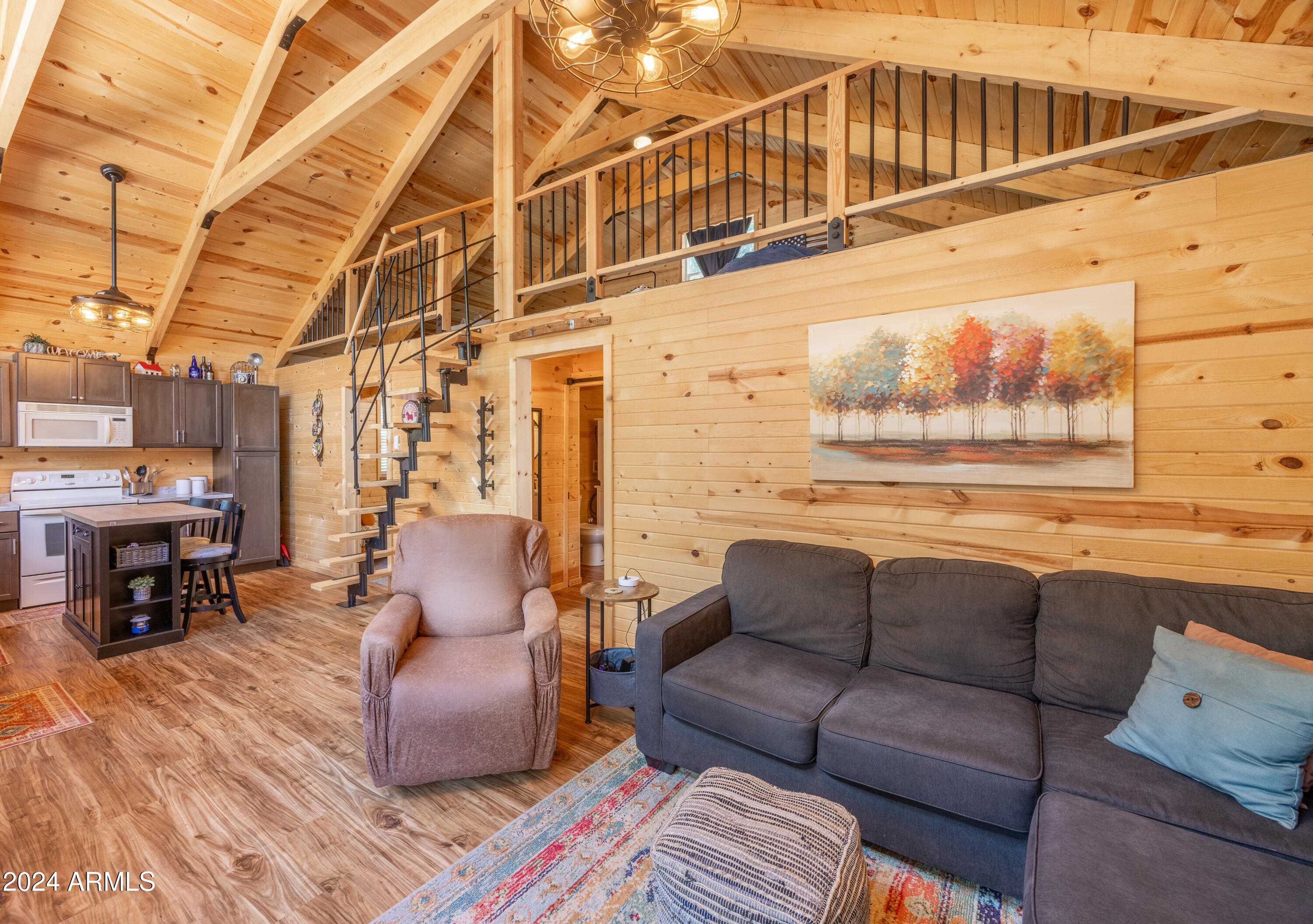 1225 Highway Loop Forest Lakes, AZ 85931 - Photo 11 of 45 a roof deck with couch and chairs