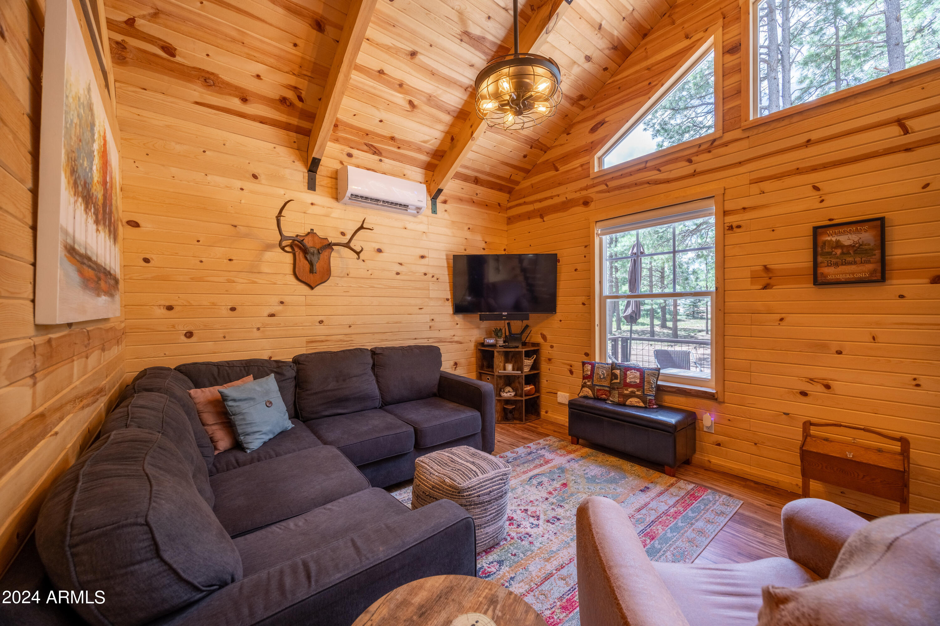 1225 Highway Loop Forest Lakes, AZ 85931 - Photo 12 of 45 a living room with furniture fireplace and a flat screen tv