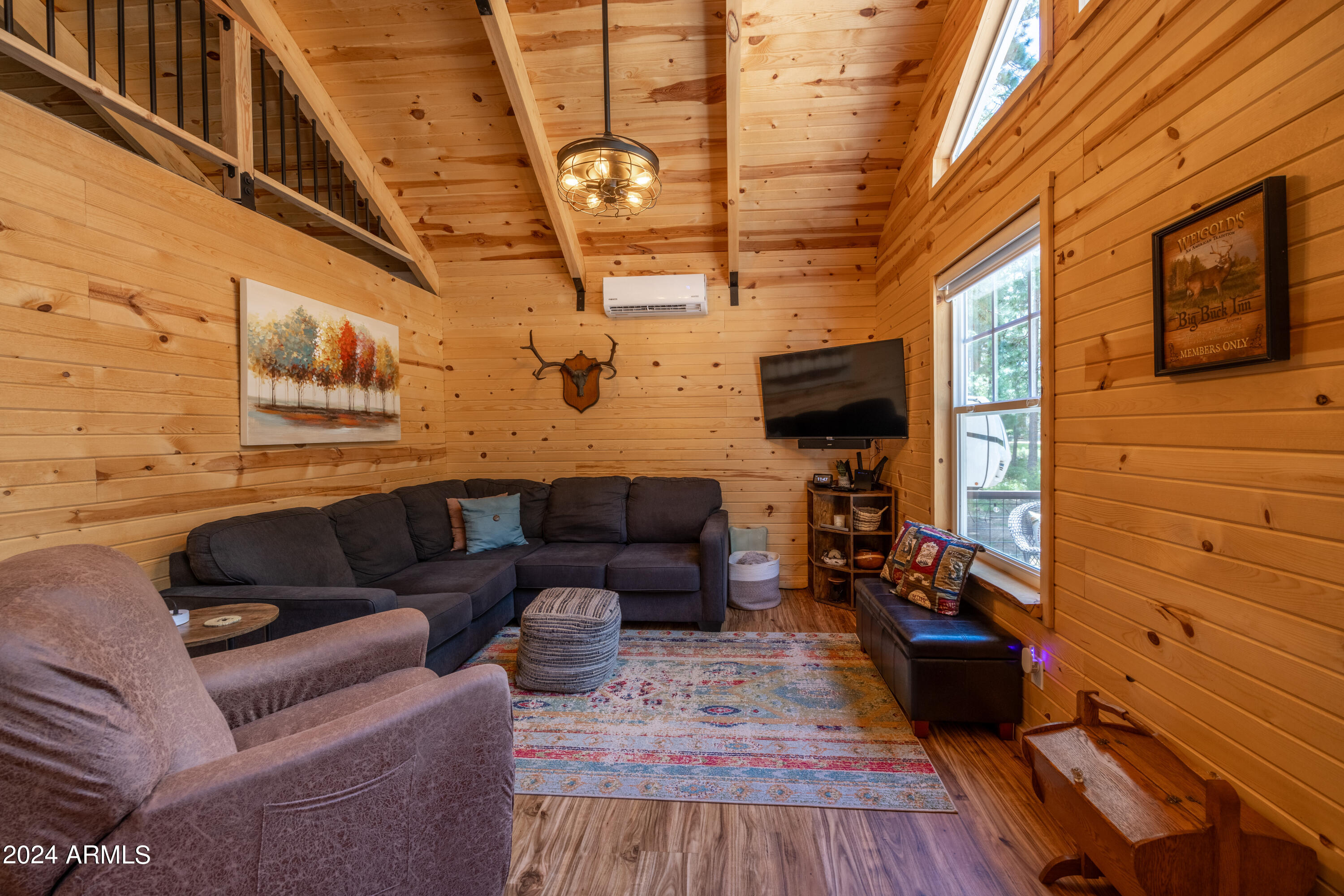 1225 Highway Loop Forest Lakes, AZ 85931 - Photo 13 of 45 a living room with furniture and a flat screen tv
