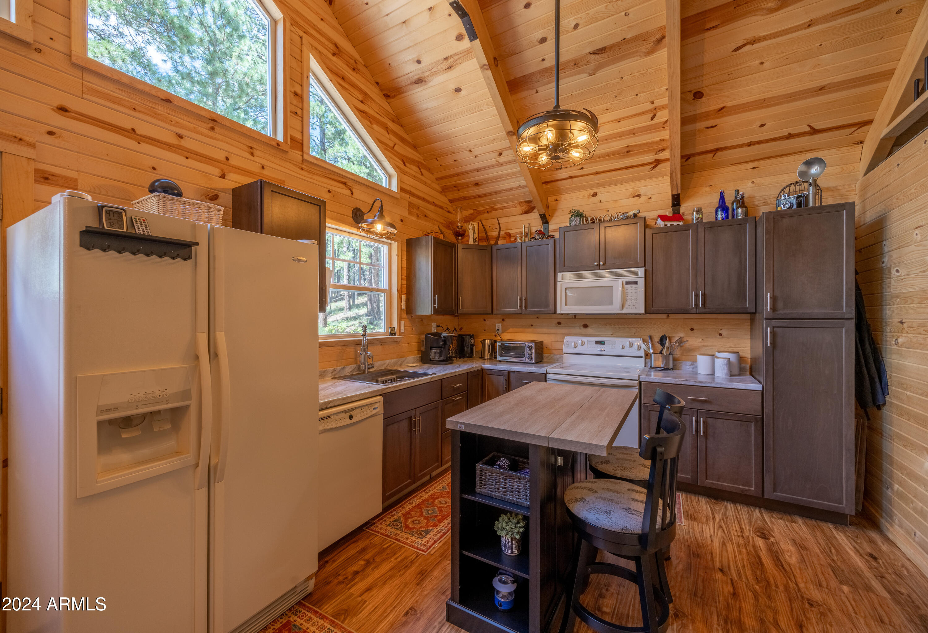1225 Highway Loop Forest Lakes, AZ 85931 - Photo 16 of 45 a kitchen with stainless steel appliances granite countertop a refrigerator and a stove