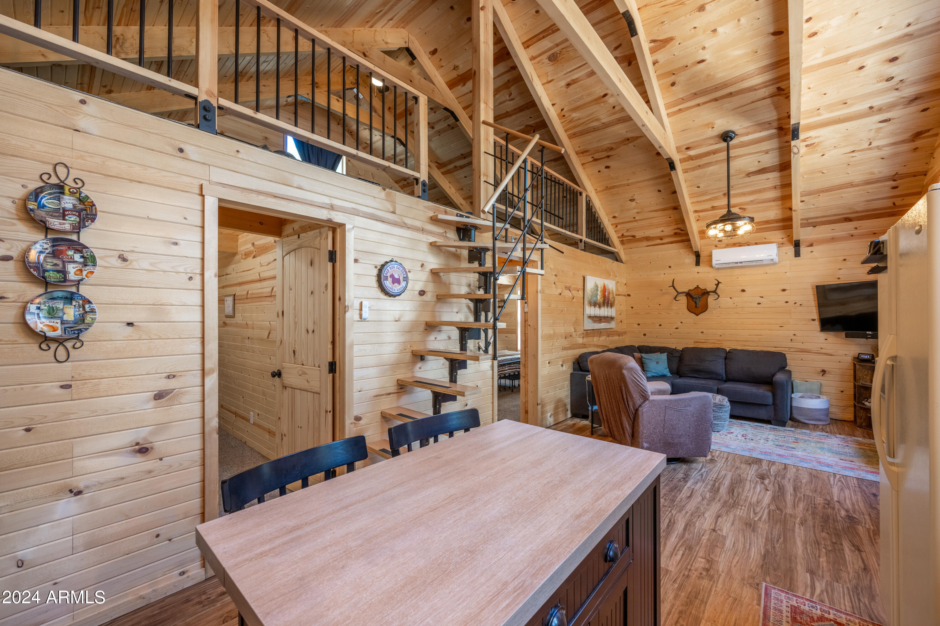 1225 Highway Loop Forest Lakes, AZ 85931 - Photo 17 of 45 a bedroom with a bed and a table