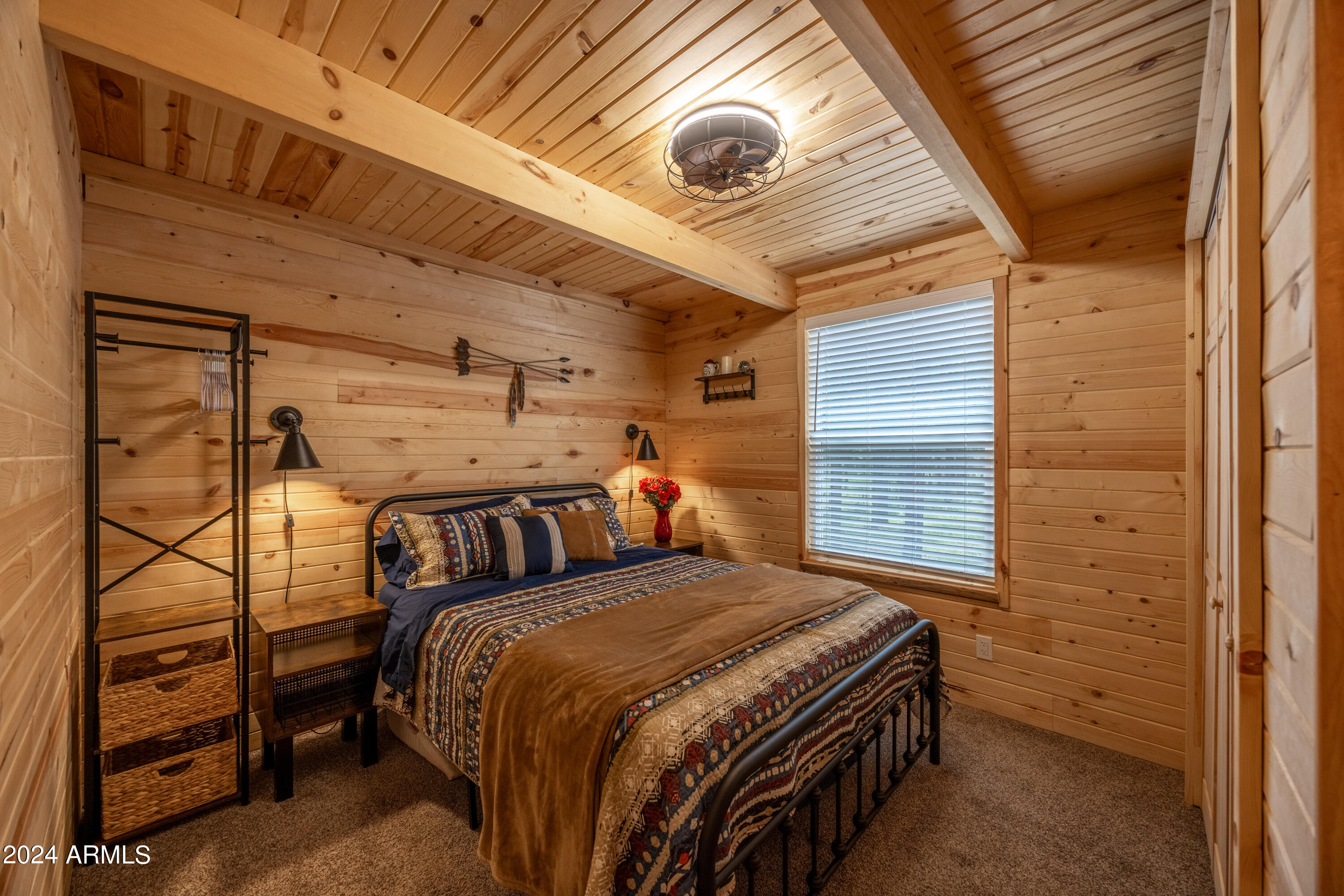 1225 Highway Loop Forest Lakes, AZ 85931 - Photo 20 of 45 a bed sitting in a bedroom next to a window